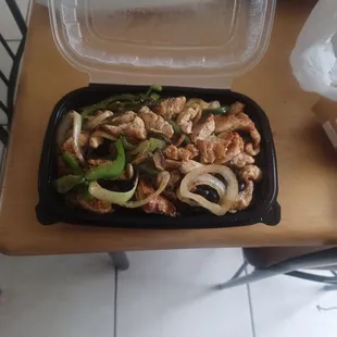 A pound and then some of rice beans chicken peppers onions and mushrooms all for 10.99