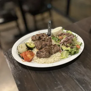 Filet Mignon Kabob Plate: Filet-Mignon steak kabob. Served w/basmati rice, grilled veggies, salad &amp; garlic sauce | $19.95