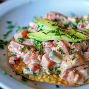 Ahi Poke Tostada Appetizer - Sushi grade ahi tuna served on a crunchy tostada, topped w/avocado