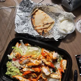Chicken Kabob Baja Bowl w/Guacamole, Grilled Pita, And garlic Sauce. There was wine I had with it too. Everything was perfect.