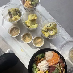 Poke in a cup  Tempura sushi in a cup - spicy tuna, spicy crab and california rolls  Chirashi bowl