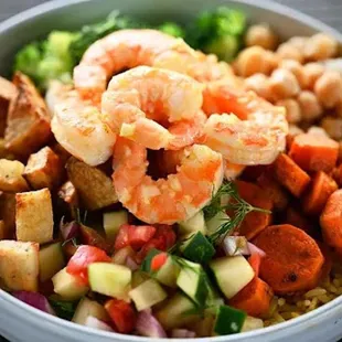 a bowl of shrimp and vegetables