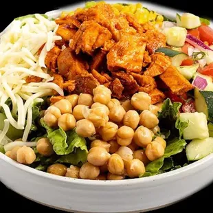 a bowl of salad with chicken and chickpeas