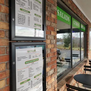 menus and tables outside of a restaurant