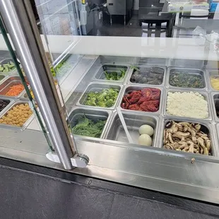 a variety of salads and condiments