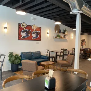 a coffee shop with tables and chairs