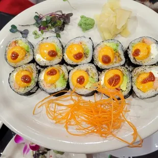 a person holding a plate of sushi