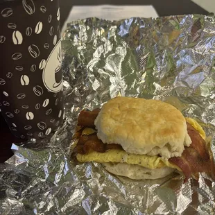 Bacon egg and cheese and coffee in breakfast area.