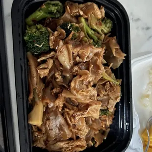 chicken, broccoli, and rice in a plastic container