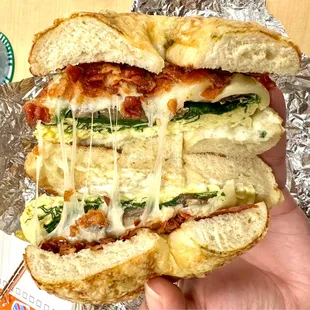 Spinach Mushroom Swiss Eggwich with bacon on 5 cheese bagel