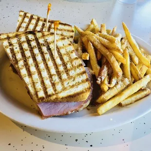 a sandwich and fries on a plate