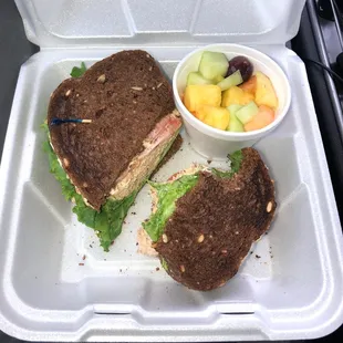Tuna salad sandwich and fresh cut fruit