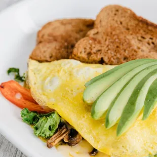 an omelet with vegetables and bread