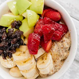 a bowl of fruit and oatmeal