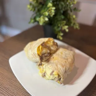 a breakfast burrito on a plate