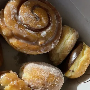 Giant cinnamon roll (always that size), old fashion, sugar coated jelly filled, chocolate donuts.