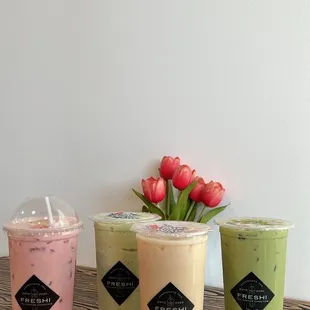 three different drinks on a table