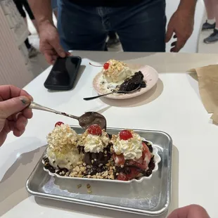 Banana split and hot fudge brownie! Absolutely love that they use real plates, bowls, and spoons.