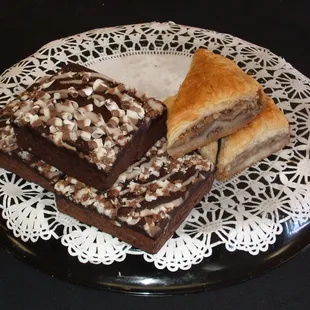 three pieces of cake on a doily plate
