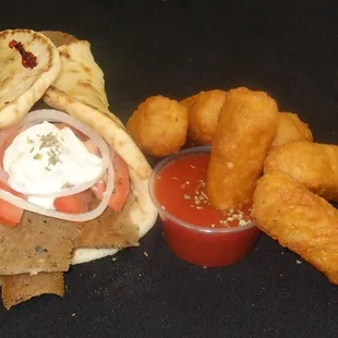 Freshly sliced Gyros sandwich with Mozzarella sticks