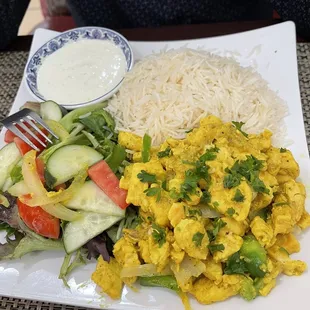 Chicken and rice with salad on the side