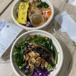 two bowls of food on a table