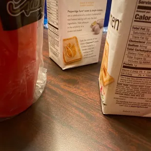 a bag of cheesemen next to a packet of cheesemen