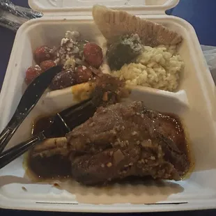 Lamb, salad, pilaff, stuffed grape leaf and a cheesy breaded thing