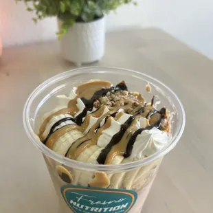 an ice cream sundae in a plastic cup