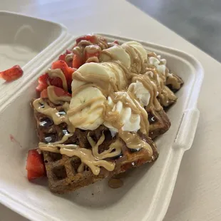 Bananas, strawberry, and peanut butter waffles.