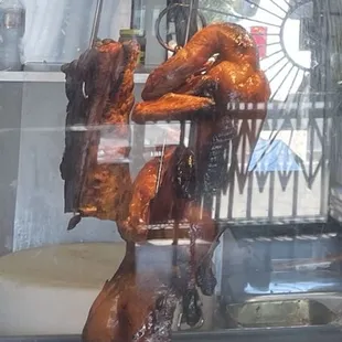 Roast duck hanging in the warmer