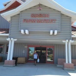 a woman standing in front of the store