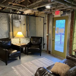 a living room with exposed ceilings