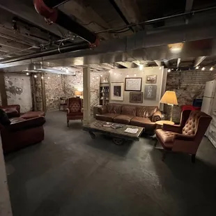 a living room with exposed ceilings