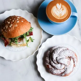 Breakfast Bun with Bacon, Cardamom Knot, and a latte.