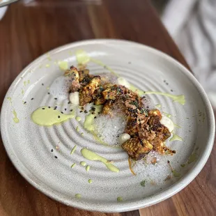 a plate of food on a wooden table