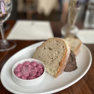 a plate of food with bread and dip