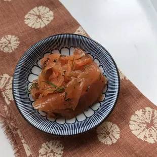 a blue and white bowl of food