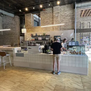 a man standing at a counter