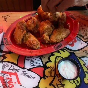 a plate of fried chicken wings