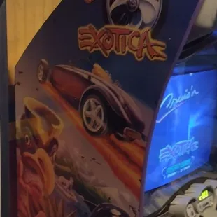 an arcade machine with a video game in front of it