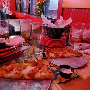 The pile of dishes that has never left our table.  We've been done eating for 20+ minutes.