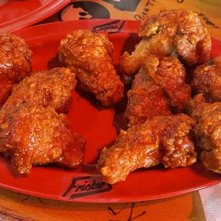 chicken wings on a red plate