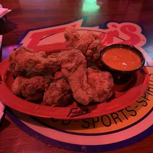 Drum wings dry with hot garlic sauce on the side.