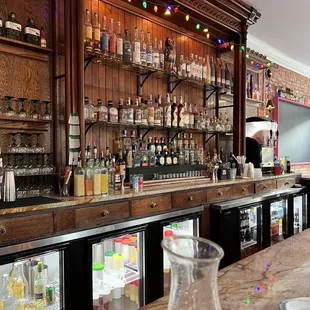 a bar with many bottles of alcohol