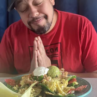 Babe - and a plate of chilaquiles, shredded pollo, chips and salsa. He liked it!