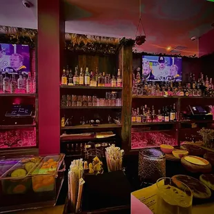 a bar with a variety of drinks