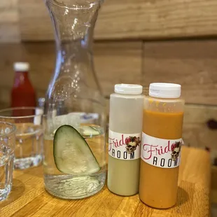 Salsas and water with a slice of cucumber