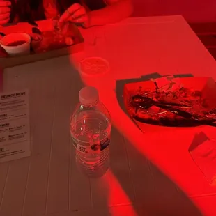 a woman sitting at a table with food