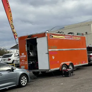 a food truck parked in a parking lot